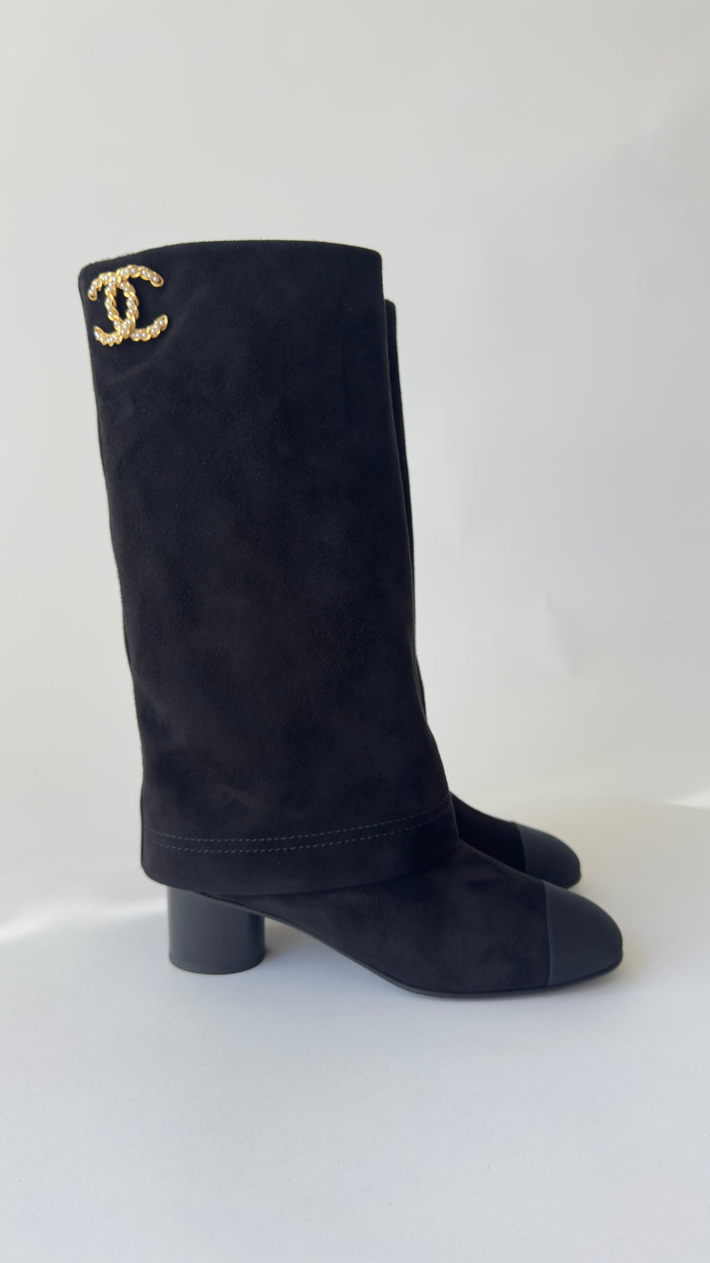 Chanel’s 2024 Métiers d’Art collection high-knee suede and leather combo Chanel logo on top