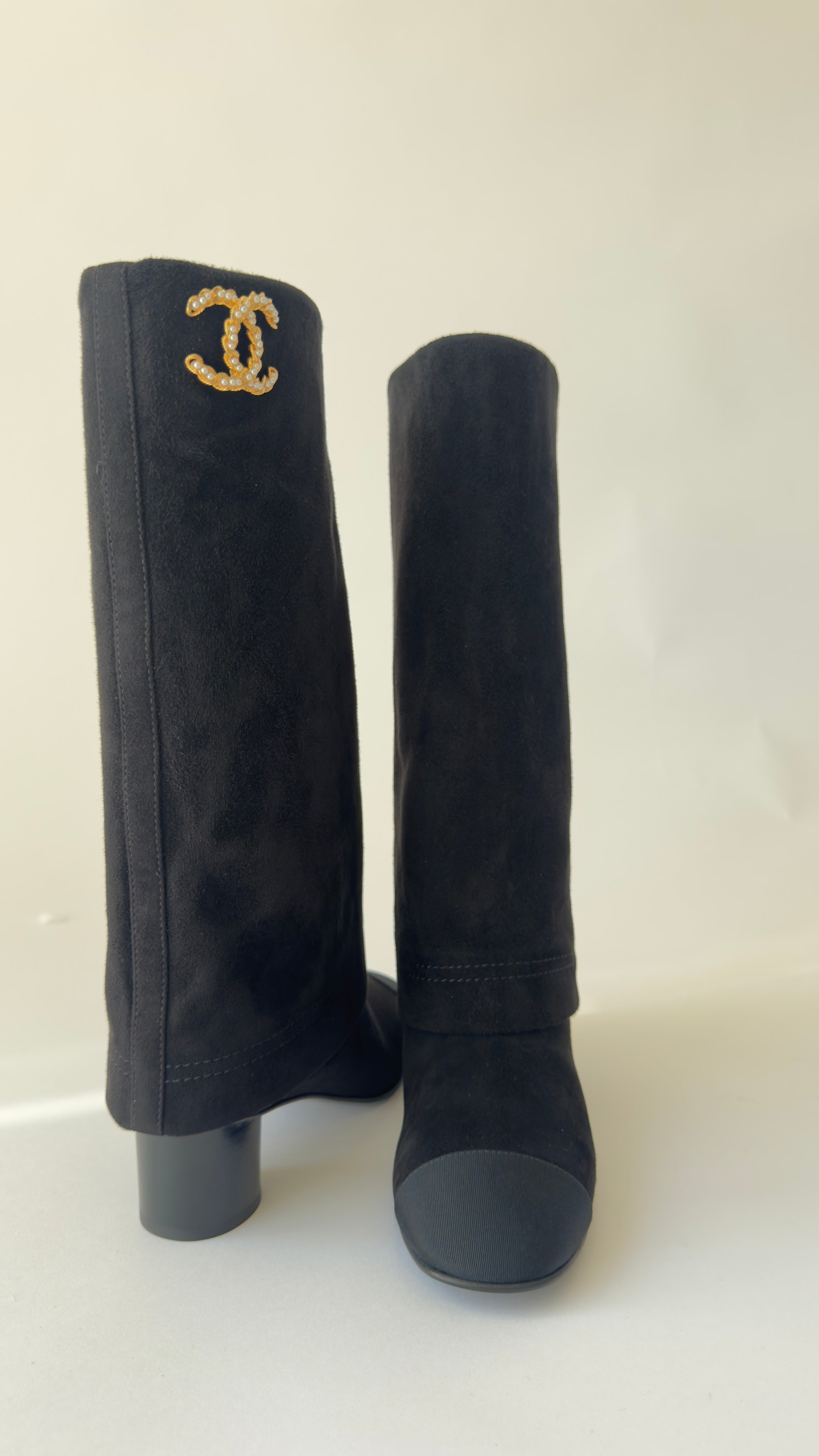 Chanel’s 2024 Métiers d’Art collection high-knee suede and leather combo Chanel logo on top