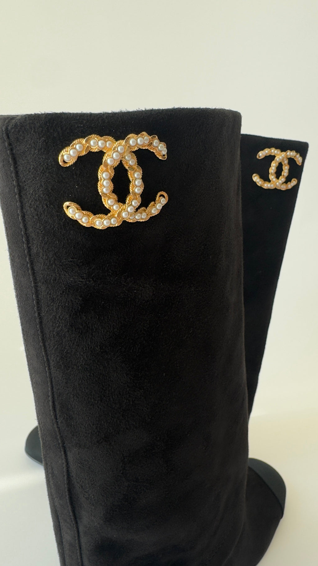 Chanel’s 2024 Métiers d’Art collection high-knee suede and leather combo Chanel logo on top