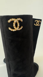 Chanel’s 2024 Métiers d’Art collection high-knee suede and leather combo Chanel logo on top