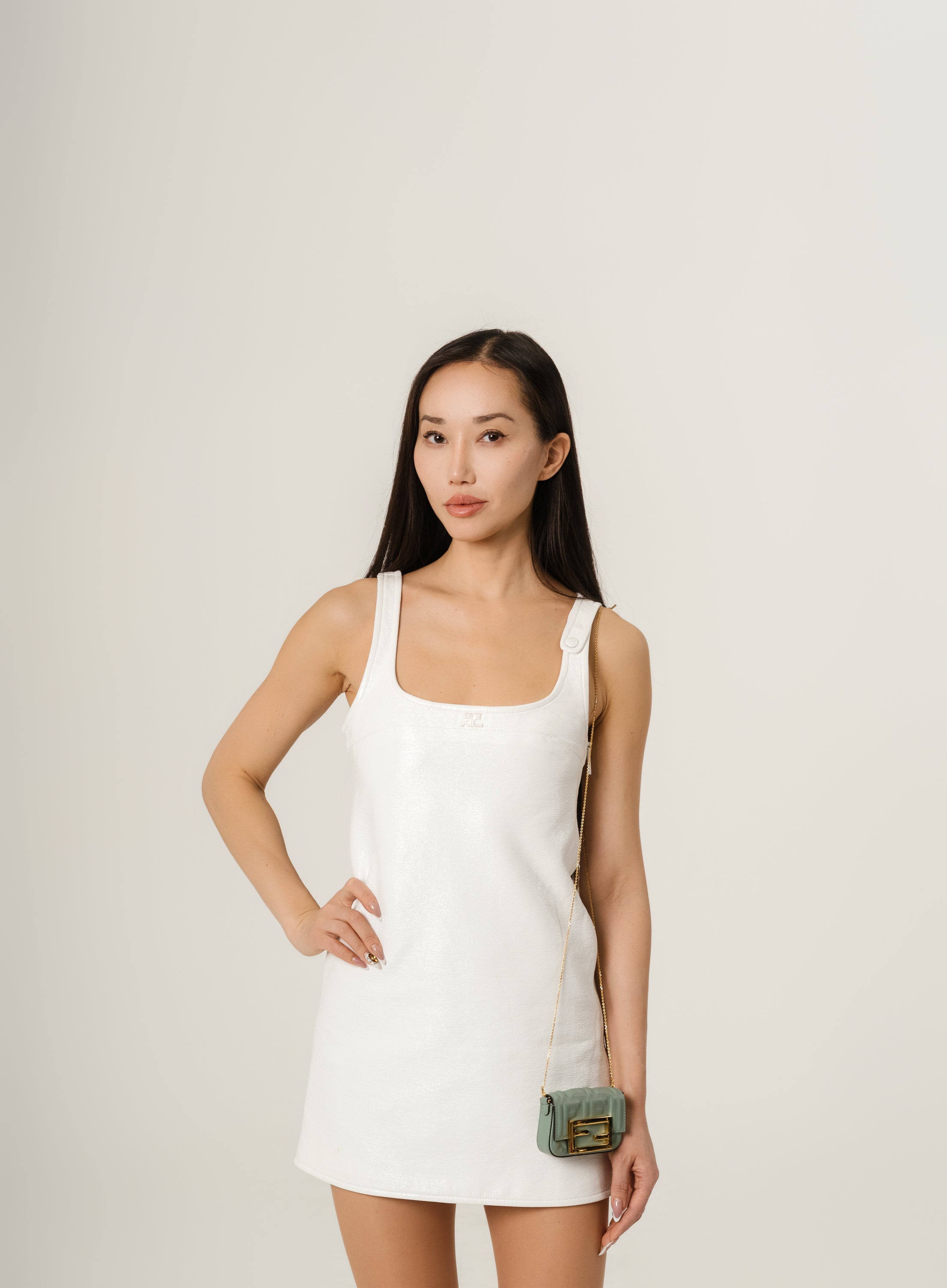 Courrēges Sleeveless vinyl dress with straps.