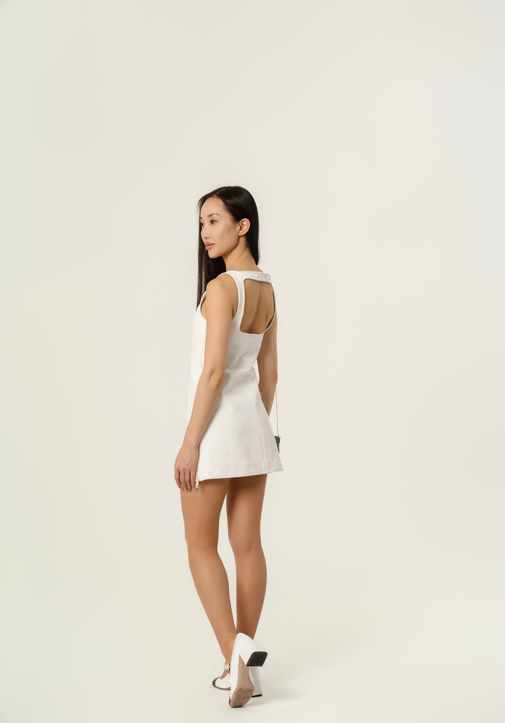 Courrēges Sleeveless vinyl dress with straps.