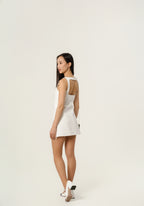 Courrēges Sleeveless vinyl dress with straps.