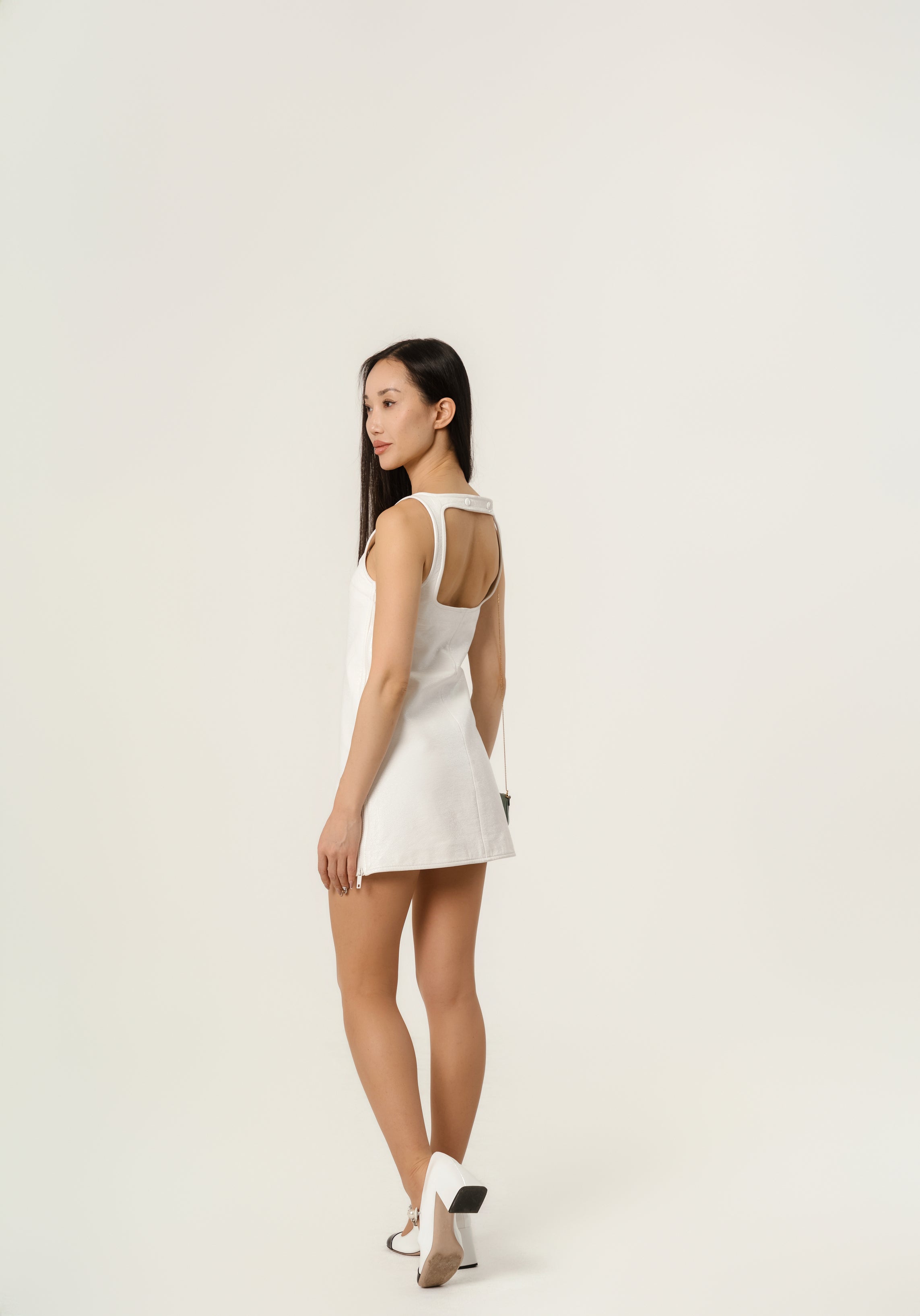 Courrēges Sleeveless vinyl dress with straps.