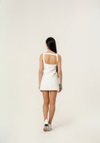 Courrēges Sleeveless vinyl dress with straps.