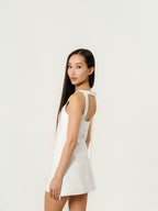 Courrēges Sleeveless vinyl dress with straps.