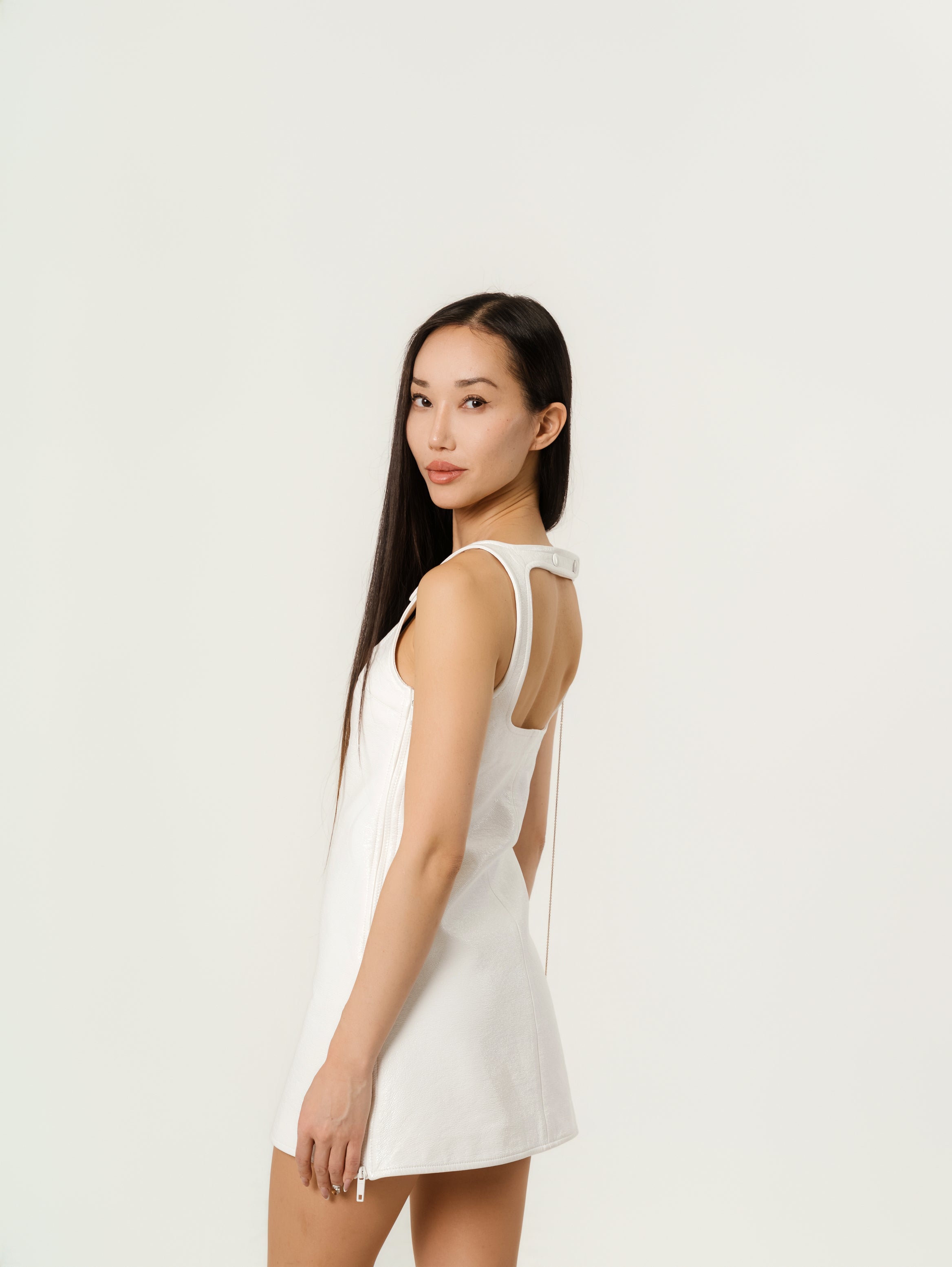 Courrēges Sleeveless vinyl dress with straps.